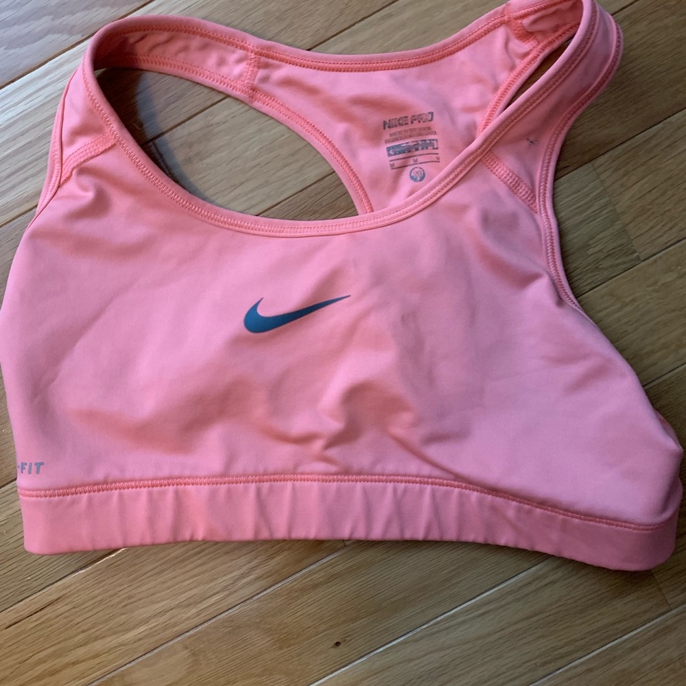 Used Nike sports bra size medium in orange/pink